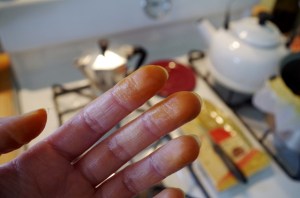 A's hat on my fingers